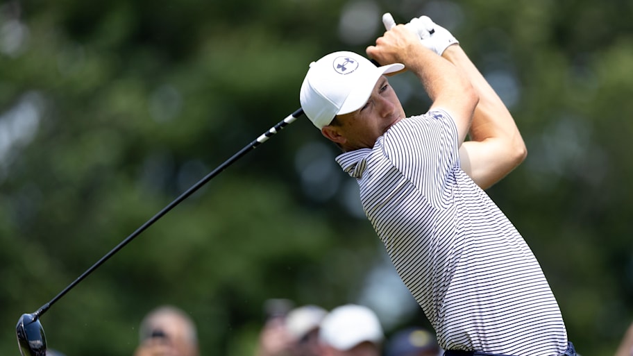 Jordan Spieth plays his shot from the first tee during the first round of the Travelers Championship. | Bill Streicher-Imagn Images