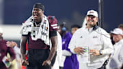 Mississippi State Bulldogs tight end Emeka Iloh (84) and head coach Jeff Lebby react during the second half against the Alcorn State Braves at Davis Wade Stadium at Scott Field.