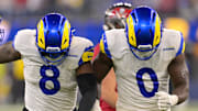 Nov 23, 2025; Inglewood, California, USA; Los Angeles Rams linebacker Jared Verse (8) and linebacker Byron Young (0) celebrate after a sack of Tampa Bay Buccaneers quarterback Teddy Bridgewater (10) in the second half at SoFi Stadium. Mandatory Credit: Jayne Kamin-Oncea-Imagn Images