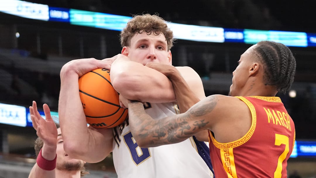 Mar 11, 2026; Chicago, IL, USA; Washington Huskies forward Hannes Steinbach (6) and Southern California Trojans guard Jordan Marsh (7) go for the ball during the overtime at United Center. Mandatory Credit: David Banks-Imagn Images