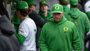 Oregon head coach Mark Wasikowski walks the dugout as the Oregon Ducks host the Minnesota Golden Gophers Saturday, March 15, 2025, at PK Park in Eugene, Ore.