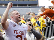 Texas Longhorns quarterback Quinn Ewers celebrates after emphatic road win in Ann Arbor.