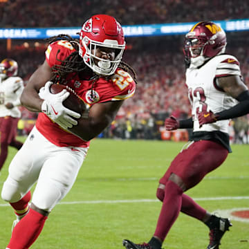 Oct 27, 2025; Kansas City, Missouri, USA; Kansas City Chiefs running back Kareem Hunt (29) carries the ball for a touchdown against the Washington Commanders during the third quarter of the game at GEHA Field at Arrowhead Stadium. Mandatory Credit: Denny Medley-Imagn Images
