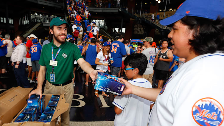 Mets fans receiving Noah Syndergaard as Thor bobbleheads on July 22, 2017.