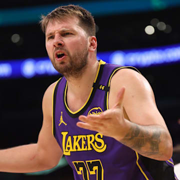 Mar 31, 2025; Los Angeles, California, USA;  Los Angeles Lakers guard Luka Doncic (77) reacts to a play during the third quarter against the Houston Rockets at Crypto.com Arena. Mandatory Credit: Kiyoshi Mio-Imagn Images