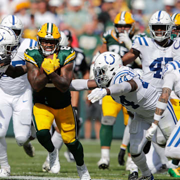 Green Bay Packers running back Josh Jacobs (8) runs for a first down in the fourth quarter against the Indianapolis Colts.