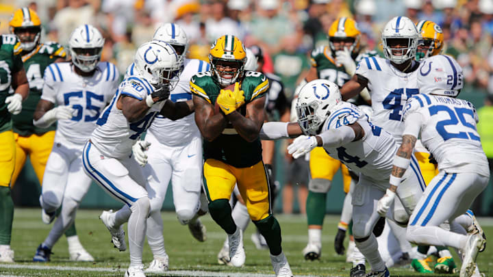 Green Bay Packers running back Josh Jacobs (8) runs for a first down in the fourth quarter against the Indianapolis Colts.