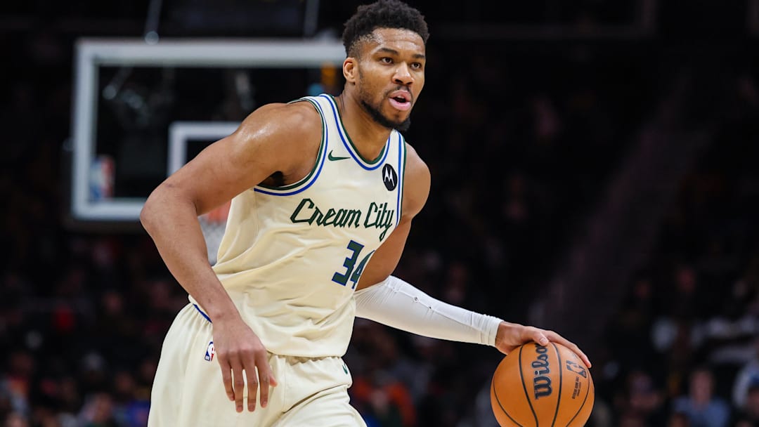 Jan 19, 2026; Atlanta, Georgia, USA; Milwaukee Bucks forward Giannis Antetokounmpo (34) dribbles the ball down the court against the Atlanta Hawks during the fourth quarter at State Farm Arena.