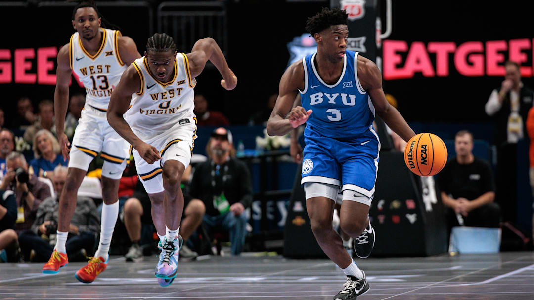 Mar 11, 2026; Kansas City, MO, USA; BYU Cougars forward AJ Dybantsa (3) brings the ball up court ahead of West Virginia Mountaineers forward Brenen Lorient (0) during the second half at T-Mobile Center. Mandatory Credit: William Purnell-Imagn Images