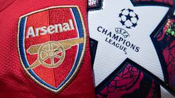 The Arsenal Club Badge with a UEFA Champions League Match Ball The Arsenal Club Badge with a UEFA Champions League Match Ball