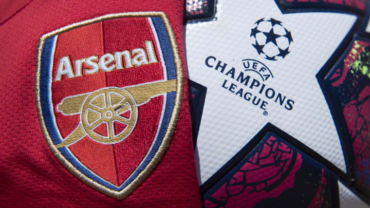 The Arsenal Club Badge with a UEFA Champions League Match Ball The Arsenal Club Badge with a UEFA Champions League Match Ball