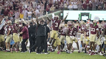 Aug 30, 2025; Tallahassee, Florida, USA; Florida State Seminoles running back Kam Davis (3) and associate head coach Odell Haggins react after a play Alabama Crimson Tide during the second half at Doak S. Campbell Stadium. Mandatory Credit: Melina Myers-Imagn Images
