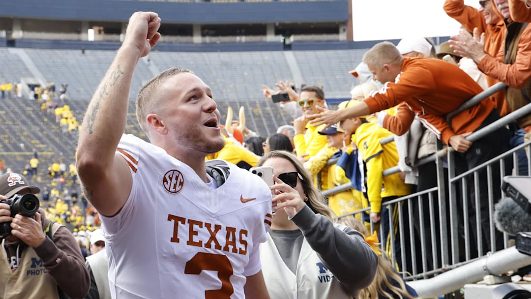 Sep 7, 2024; Ann Arbor, Michigan, USA; Texas Longhorns quarterback Quinn Ewers (3) celebrates after defeating the Michigan Wolverines at Michigan Stadium. Mandatory Credit: Rick Osentoski-Imagn Images