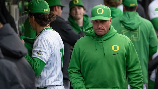 Oregon head coach Mark Wasikowski walks the dugout as the Oregon Ducks host the Minnesota Golden Gophers