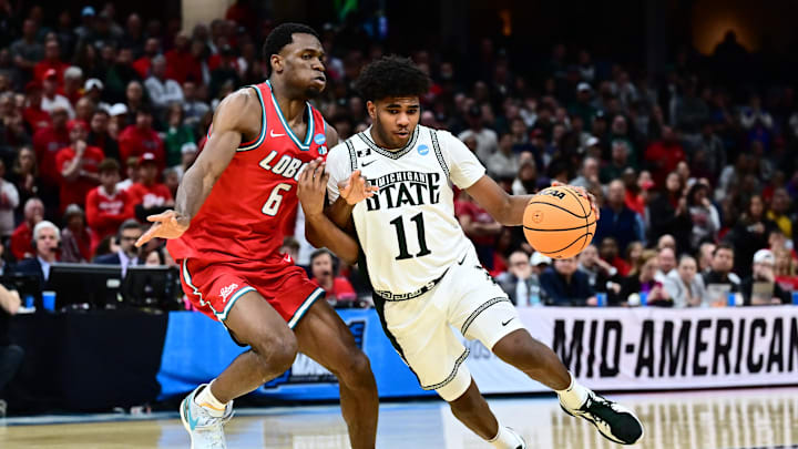 Michigan State Spartans guard Jase Richardson (11) dribbles defended by New Mexico Lobos forward Atiki Ally Atiki 