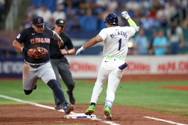 Josh Naylor tags the bag before Richie Palacios