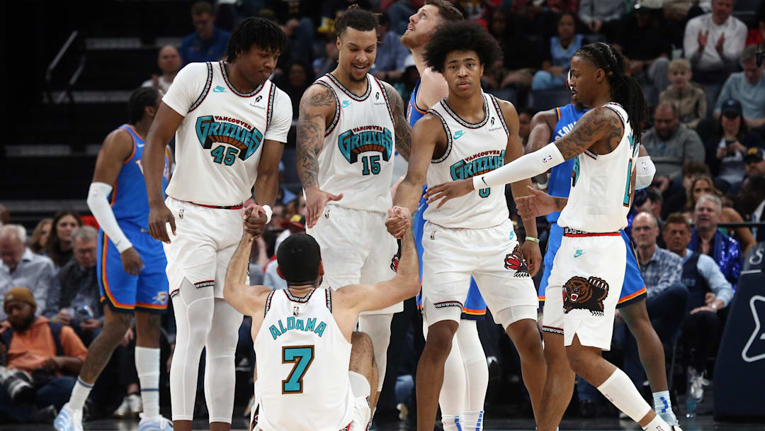 Feb 8, 2025; Memphis, Tennessee, USA; Memphis Grizzlies forward GG Jackson II (45), forward Brandon Clarke (15), forward Jaylen Wells (0) and guard Ja Morant (12) help forward Santi Aldama (7) during the second quarter against the Oklahoma City Thunder at FedExForum. Mandatory Credit: Petre Thomas-Imagn Images Feb 8, 2025; Memphis, Tennessee, USA; Memphis Grizzlies forward GG Jackson II (45), forward Brandon Clarke (15), forward Jaylen Wells (0) and guard Ja Morant (12) help forward Santi Aldama (7) during the second quarter against the Oklahoma City Thunder at FedExForum. Mandatory Credit: Petre Thomas-Imagn Images