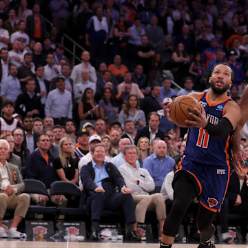 Apr 30, 2024; New York, New York, USA; New York Knicks guard Jalen Brunson (11) drives to the basket against Philadelphia 76ers center Joel Embiid (21) during overtime in game 5 of the first round of the 2024 NBA playoffs at Madison Square Garden. Mandatory Credit: Brad Penner-Imagn Images