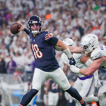 Dec 16, 2024; Minneapolis, Minnesota, USA; Chicago Bears quarterback Caleb Williams (18) passes against the Minnesota Vikings linebacker Andrew Van Ginkel (43) in the third quarter at U.S. Bank Stadium. Mandatory Credit: Brad Rempel-Imagn Images