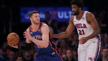 Apr 30, 2024; New York, New York, USA; New York Knicks center Isaiah Hartenstein (55) looks to pass the ball against Philadelphia 76ers center Joel Embiid (21) during the first quarter of game 5 of the first round of the 2024 NBA playoffs at Madison Square Garden. Mandatory Credit: Brad Penner-USA TODAY Sports