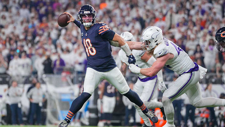 Dec 16, 2024; Minneapolis, Minnesota, USA; Chicago Bears quarterback Caleb Williams (18) passes against the Minnesota Vikings linebacker Andrew Van Ginkel (43) in the third quarter at U.S. Bank Stadium.