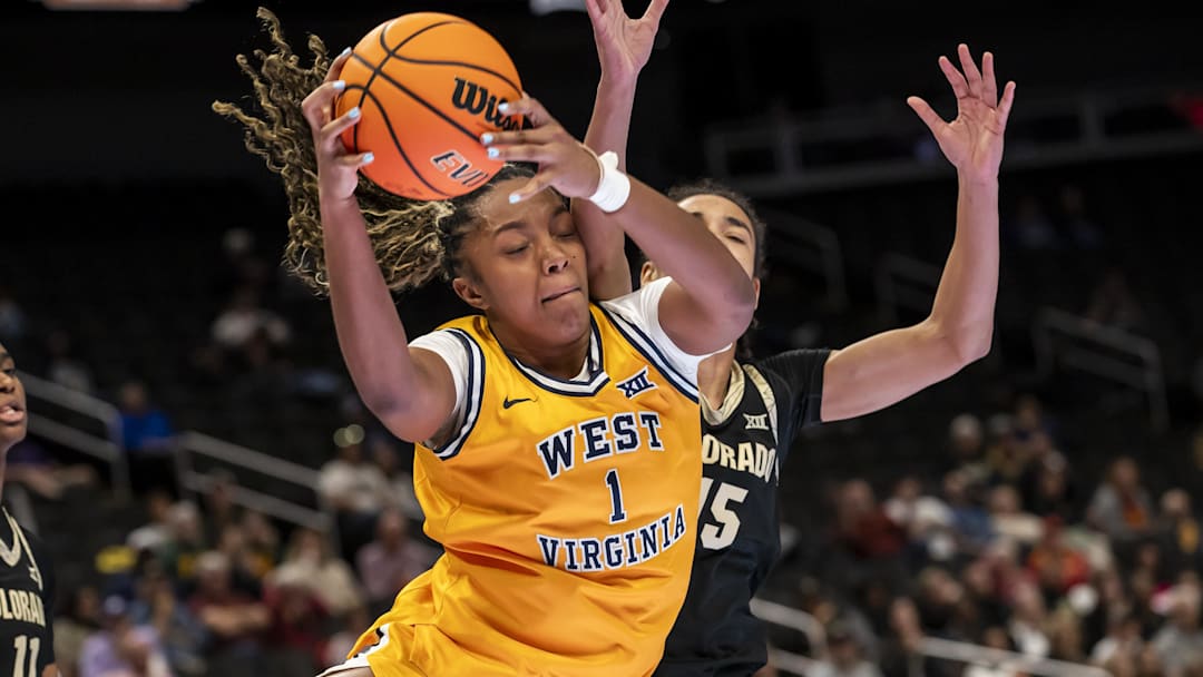 Mar 7, 2026; Kansas City, MO, USA;  West Virginia Mountaineers forward Carter McCray (1) brings down a rebound against the Colorado Buffaloes during the second half at T-Mobile Center. Mandatory Credit: Nick Tre. Smith-Imagn Images