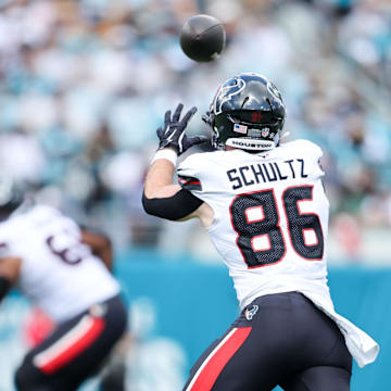 Sep 21, 2025; Jacksonville, Florida, USA; Houston Texans tight end Dalton Schultz (86) receives a pass during the first quarter against the Jacksonville Jaguars at EverBank Stadium. Mandatory Credit: Morgan Tencza-Imagn Images
