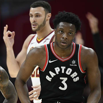 Apr 3, 2018; Cleveland, OH, USA; Toronto Raptors forward OG Anunoby (3) and Cleveland Cavaliers forward Larry Nance Jr. (22) react after a three-point basket by forward LeBron James (23) in the first quarter Quicken Loans Arena. Mandatory Credit: David Richard-Imagn Images