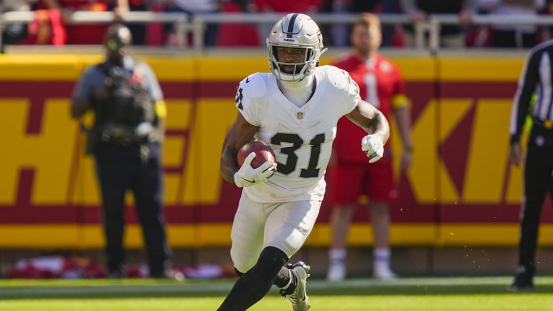 Oct 19, 2025; Kansas City, Missouri, USA; Las Vegas Raiders running back Raheem Mostert (31) returns a kickoff during the first half against the Kansas City Chiefs at GEHA Field at Arrowhead Stadium. Mandatory Credit: Jay Biggerstaff-Imagn Images