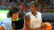 Oct 4, 2025; Charlotte, NC, USA; North Carolina Tar Heels forward Caleb Wilson (8) with the ball as forward Jarin Stevenson (15) defends in the first half at Dean E. Smith Center. Mandatory Credit: Bob Donnan-Imagn Images