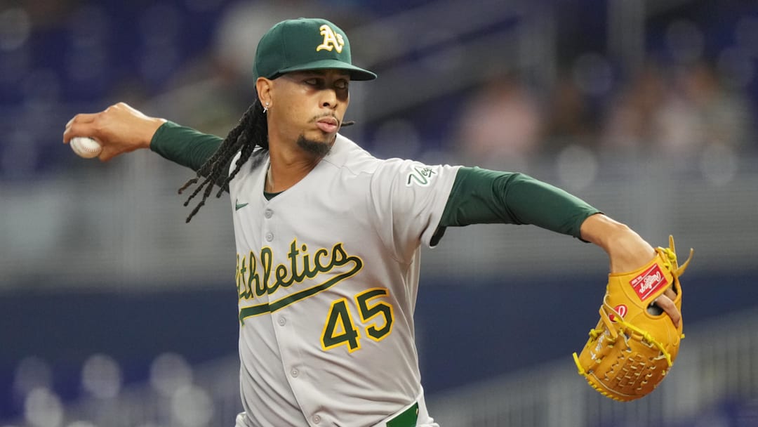 May 3, 2025; Miami, Florida, USA;  Oakland Athletics pitcher Osvaldo Bido (45) pitches in the first inning against the Miami Marlins at loanDepot Park. Mandatory Credit: Jim Rassol-Imagn Images