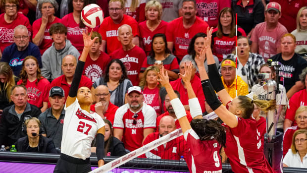 Nebraska Cornhuskers outside hitter Harper Murray (27) attacks against Wisconsin Badgers middle blocker Caroline Crawford (9)