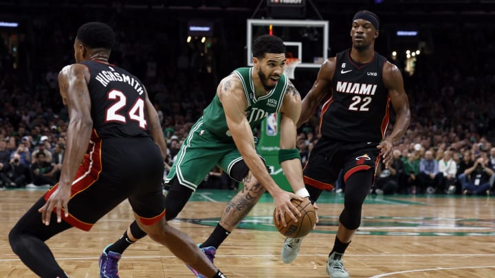 May 25, 2023; Boston, Massachusetts, USA; Boston Celtics forward Jayson Tatum (0) controls the ball against Miami Heat forward Jimmy Butler (22) and forward Haywood Highsmith (24) during the third quarter in game five of the Eastern Conference Finals for the 2023 NBA playoffs at TD Garden. Mandatory Credit: Winslow Townson-USA TODAY Sports