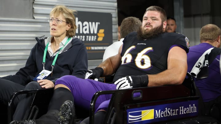 Oct 11, 2021; Baltimore, Maryland, USA; Baltimore Ravens guard Ben Cleveland (66) is carted off the field after being injured against the Indianapolis Colts during the second quarter at M&T Bank Stadium. Mandatory Credit: Geoff Burke-USA TODAY Sports