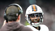 Nov 23, 2025; Paradise, Nevada, USA; Cleveland Browns quarterback Shedeur Sanders (12) talks to head coach Kevin Stefanski in the first half against the Las Vegas Raiders at Allegiant Stadium. Mandatory Credit: Stephen R. Sylvanie-Imagn Images