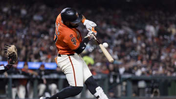 Aug 30, 2024; San Francisco, California, USA; San Francisco Giants left fielder Heliot Ramos (17) hits a single against the Miami Marlins during the sixth inning at Oracle Park. 