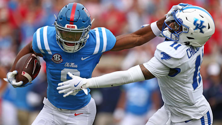 Sep 28, 2024; Oxford, Mississippi, USA; Mississippi Rebels wide receiver Tre Harris (9) stiff arms Kentucky Wildcats defensive back Zion Childress (11) after a catch during the first half at Vaught-Hemingway Stadium. Mandatory Credit: Petre Thomas-Imagn Images Sep 28, 2024; Oxford, Mississippi, USA; Mississippi Rebels wide receiver Tre Harris (9) stiff arms Kentucky Wildcats defensive back Zion Childress (11) after a catch during the first half at Vaught-Hemingway Stadium. Mandatory Credit: Petre Thomas-Imagn Images