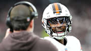 Nov 23, 2025; Paradise, Nevada, USA; Cleveland Browns quarterback Shedeur Sanders (12) talks to head coach Kevin Stefanski in the first half against the Las Vegas Raiders  at Allegiant Stadium. Mandatory Credit: Stephen R. Sylvanie-Imagn Images