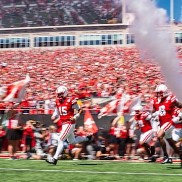 Nebraska Cornhuskers run onto the field