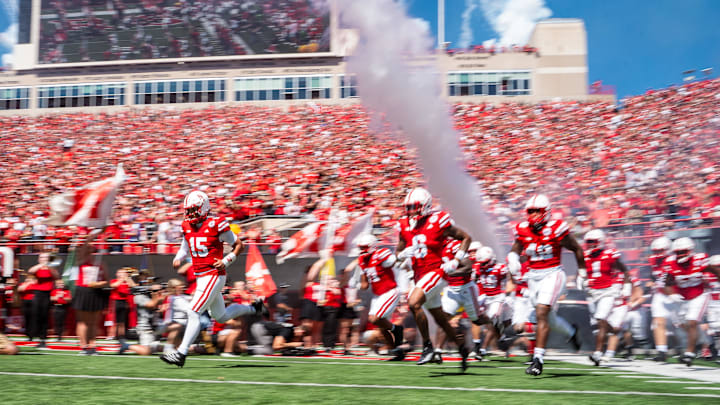 Nebraska Cornhuskers run onto the field