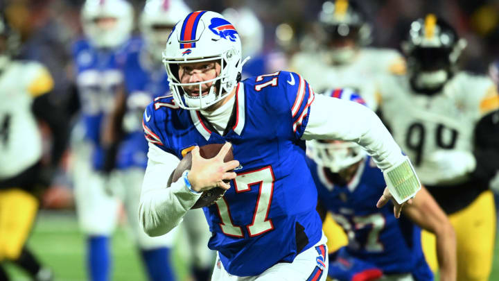 Jan 15, 2024; Orchard Park, New York, USA; Buffalo Bills quarterback Josh Allen (17) runs the ball in the first half against the Pittsburgh Steelers in a 2024 AFC wild card game at Highmark Stadium. Mandatory Credit: Mark Konezny-USA TODAY Sports