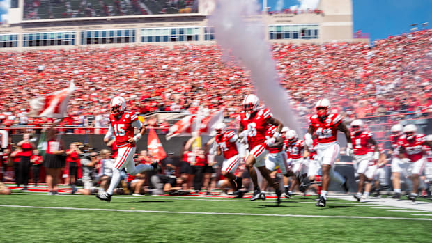 Nebraska Cornhuskers quarterback Dylan Raiola (15) runs onto the field before a game against the UTEP Miners