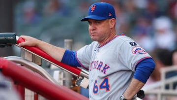 Jun 19, 2025; Atlanta, Georgia, USA; New York Mets manager Carlos Mendoza (64) in the dugout before a game against the Atlanta Braves at Truist Park. Mandatory Credit: Brett Davis-Imagn Images