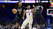 Feb 22, 2025; Philadelphia, Pennsylvania, USA; Brooklyn Nets forward Ziaire Williams (8) dribbles around Philadelphia 76ers forward Paul George (8) on the pick by center Nic Claxton (33) during the first quarter at Wells Fargo Center. Mandatory Credit: Bill Streicher-Imagn Images