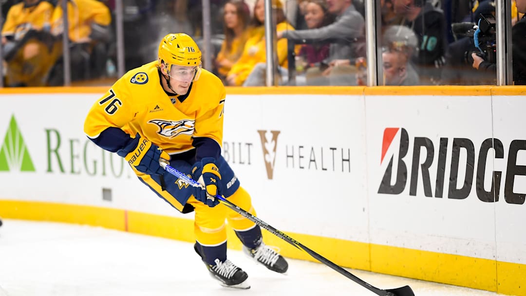 Apr 8, 2025; Nashville, Tennessee, USA;   Nashville Predators defenseman Brady Skjei (76) skates behind the net against the New York Islanders during the first period at Bridgestone Arena. Mandatory Credit: Steve Roberts-Imagn Images
