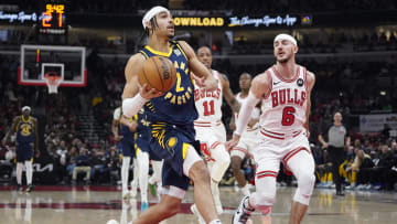 Mar 27, 2024; Chicago, Illinois, USA; Chicago Bulls guard Alex Caruso (6) defends Indiana Pacers guard Andrew Nembhard (2) during the first quarter at United Center. Mandatory Credit: David Banks-USA TODAY Sports