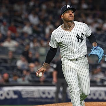 Sep 10, 2024; Bronx, New York, USA; New York Yankees starting pitcher Marcus Stroman (0) throws the ball to first base for an out during the third inning against the Kansas City Royals at Yankee Stadium. Mandatory Credit: Vincent Carchietta-Imagn Images