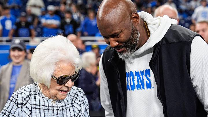 Martha Ford talks to general manager Brad Holmes during warm up at Ford Field in Detroit on Sunday, Sept. 14, 2025.