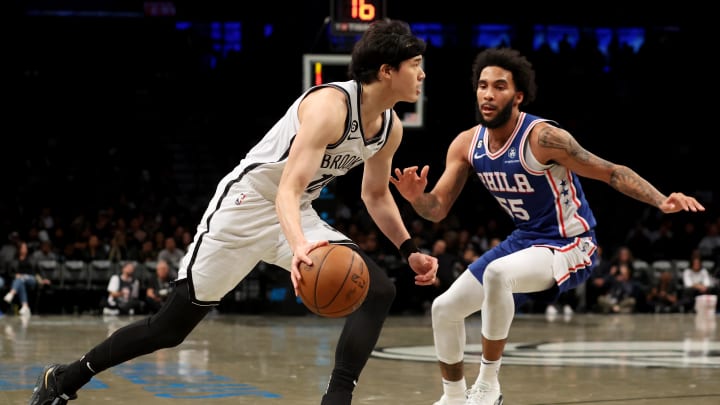 Oct 3, 2022; Brooklyn, New York, USA; Brooklyn Nets forward Yuta Watanabe (18) drives to the basket against Philadelphia 76ers guard Julian Champagnie (55) during the fourth quarter at Barclays Center. Mandatory Credit: Brad Penner-USA TODAY Sports