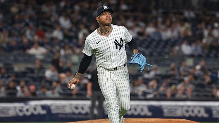 Sep 10, 2024; Bronx, New York, USA; New York Yankees starting pitcher Marcus Stroman (0) throws the ball to first base for an out during the third inning against the Kansas City Royals at Yankee Stadium. Mandatory Credit: Vincent Carchietta-Imagn Images